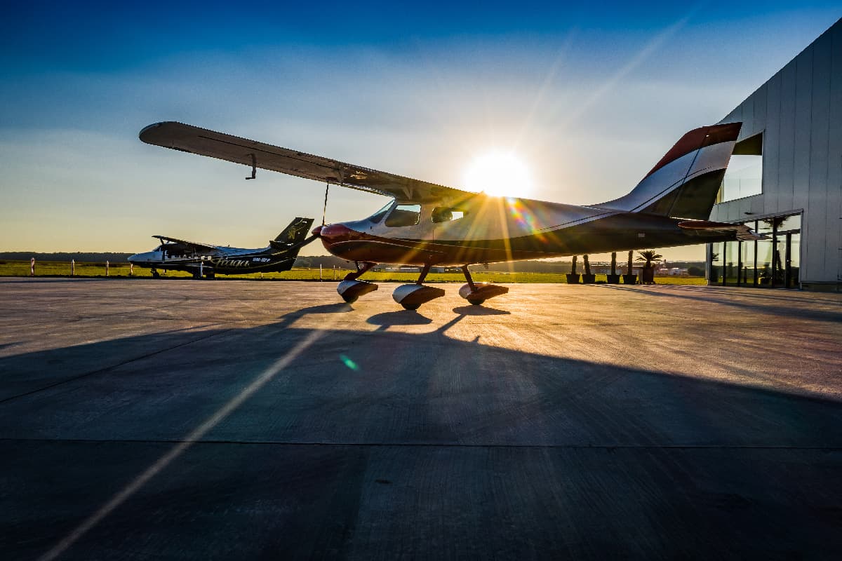 Bristell B8M silhouetted against the setting sun on the apron