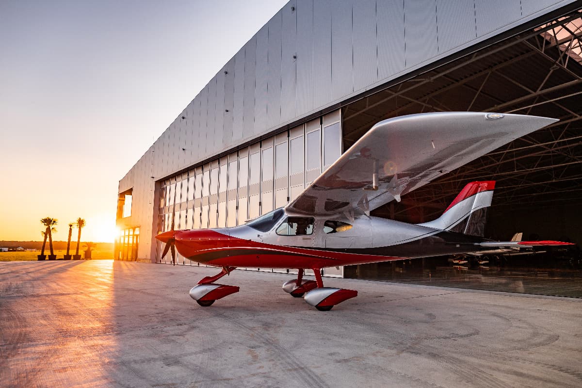 Bristell B8M parked at the hangar entrance at sunset